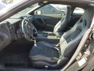 2016 Nissan GT-R Premium z VIN JN1AR5EF8GM290918, wystawiony jako Copart lot #58314455 z przebiegiem 23 667 mil mil oraz Szkody całkowita. Historia ofert i sprzedaży dostępna na DreamBid. Obrazek 7.