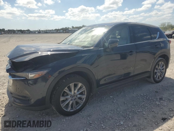 2021 Mazda CX-5 Grand Touring with VIN JM3KFADM1M0301366, listed as a Copart auction lot 52890955 with 66,686 mi miles and Non Repairable. Bid and sale history available at carsss.com. Image 1.