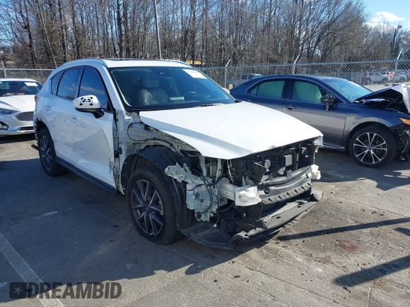 2018 Mazda CX-5 Grand Touring with VIN JM3KFBDM6J0435579, listed as a IAAI auction lot 41208899 with 131,212 mi miles. Bid and sale history available at carsss.com. Image 1.