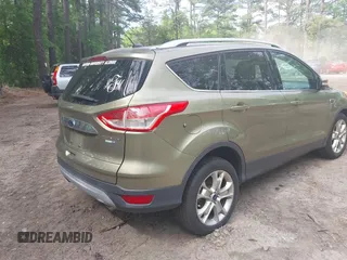 2014 Ford Escape Titanium with VIN 1FMCU9JX9EUB23972, listed as a IAAI auction lot 42217298 with 164,556 mi miles and . Bid and sale history available at DreamBid. Image 4.