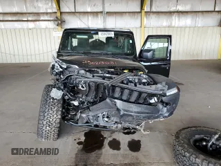 2023 Jeep Wrangler Sport S with VIN 1C4HJXDG0PW668162, listed as a Copart auction lot 45942865 with 62,944 mi miles and Salvage Title. Bid and sale history available at DreamBid. Image 5.