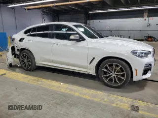 2019 BMW X4 M40i z VIN 5UXUJ5C55KLJ64198, wystawiony jako Copart lot #53028815 z przebiegiem 59 780 mil mil oraz Szkody całkowita. Historia ofert i sprzedaży dostępna na DreamBid. Obrazek 4.