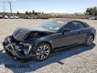 2009 BMW 6 Series 650i with VIN WBAEB53569C224337, listed as a Copart auction lot 68148974 with 75,057 mi miles and Salvage Title. Bid and sale history available at carsss.com. Image 1.