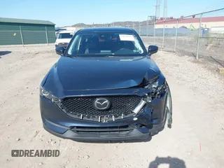 2019 Mazda CX-5 Touring with VIN JM3KFBCM8K0518806, listed as a IAAI auction lot 42038168 with 61,449 mi miles and . Bid and sale history available at DreamBid. Image 12.