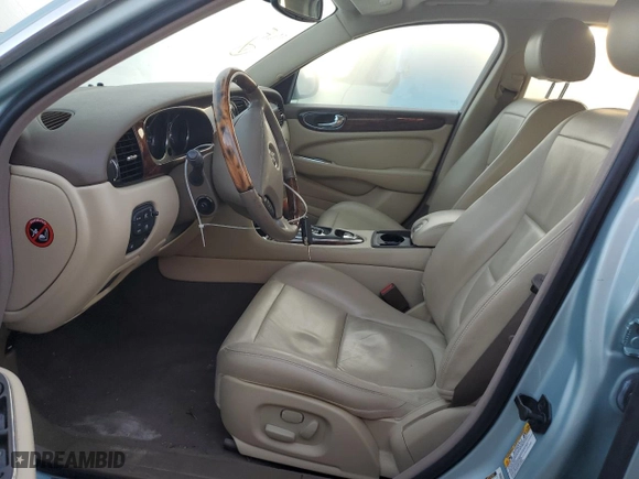 2005 Jaguar XJ with VIN SAJWA79C05SG37189, listed as a Copart auction lot 76804104 with 0 mi miles and Salvage Title. Bid and sale history available at carsss.com. Image 7.