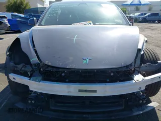 2023 Tesla Model 3 with VIN 5YJ3E1EA2PF640289, listed as a IAAI auction lot 42000200 with 14,194 mi miles and . Bid and sale history available at DreamBid. Image 6.