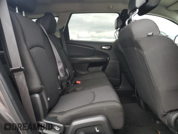 2017 Dodge Journey SE z VIN 3C4PDCAB1HT709104, wystawiony jako Copart lot #57132935 z przebiegiem 89 024 mil mil oraz Szkoda całkowita • Salvage title. Historia ofert i sprzedaży dostępna na DreamBid. Obrazek 11.