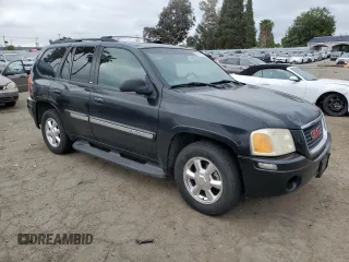 2004 GMC Envoy SLE with VIN 1GKDT13S442155788, listed as a Copart auction lot 50270135 with 164,271 mi miles and Salvage Title. Bid and sale history available at carsss.com. Image 4.