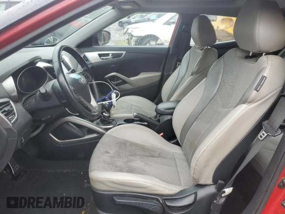 2013 Hyundai Veloster w/Gray Int z VIN KMHTC6AD0DU147454, wystawiony jako Copart lot #57814285 z przebiegiem 91 000 mil mil oraz Szkoda całkowita • Salvage title. Historia ofert i sprzedaży dostępna na DreamBid. Obrazek 7.