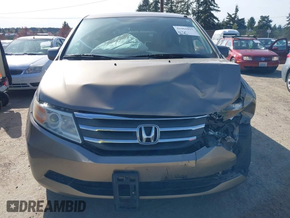 2013 Honda Odyssey LX z VIN 5FNRL5H29DB055166, wystawiony jako IAAI lot #41965037 z przebiegiem 122 470 mil mil oraz . Historia ofert i sprzedaży dostępna na DreamBid. Obrazek 12.