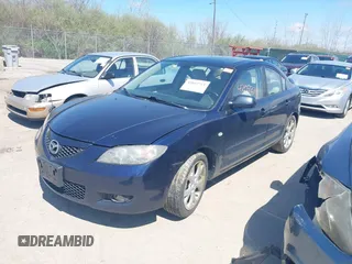 2009 Mazda Mazda3 i Touring Value with VIN JM1BK32F191193501, listed as a IAAI auction lot 42042711 with 165,234 mi miles. Bid and sale history available at carsss.com. Image 2.