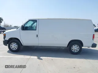 2014 Ford Econoline Cargo Commercial with VIN 1FTNE1EW4EDA90117, listed as a IAAI auction lot 42063775 with 276,021 mi miles and . Bid and sale history available at DreamBid. Image 14.