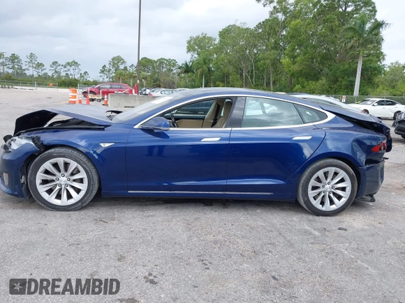 2016 Tesla Model S 70 with VIN 5YJSA1E10GF141725, listed as a IAAI auction lot 41878171 with 119,025 mi miles and . Bid and sale history available at DreamBid. Image 14.