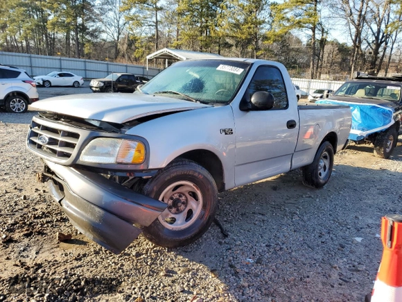 2002 Ford F-150 XL with VIN 1FTRF17202NB11513, listed as a Copart auction lot 85773084 with 120,443 mi miles and Salvage Title. Bid and sale history available at carsss.com. Image 1.