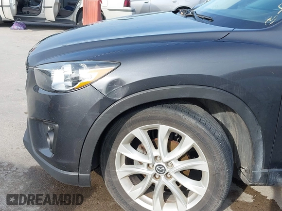 2014 Mazda CX-5 Grand Touring with VIN JM3KE2DY7E0345742, listed as a IAAI auction lot 41864116 with 158,746 mi miles. Bid and sale history available at carsss.com. Image 17.
