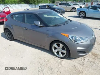 2013 Hyundai Veloster w/Gray Int with VIN KMHTC6AD9DU128725, listed as a IAAI auction lot 42648356 with 168,109 mi miles and . Bid and sale history available at DreamBid. Image 1.