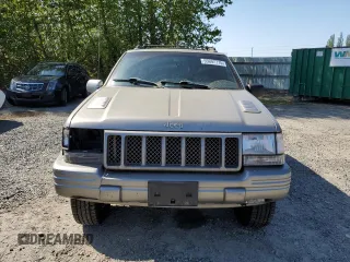 1998 Jeep Grand Cherokee Limited z VIN 1J4GZ88Z1WC231772, wystawiony jako Copart lot #55697775 z przebiegiem 178 896 mil mil oraz Czysty tytuł • Clean title. Historia ofert i sprzedaży dostępna na DreamBid. Obrazek 5.