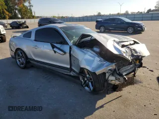 2010 Ford Mustang GT500 with VIN 1ZVBP8JS3A5156425, listed as a Copart auction lot 77348134 with 61,984 mi miles and Salvage title. Bid and sale history available at DreamBid. Image 4.