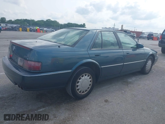 1993 Cadillac Seville STS z VIN 1G6KY5298PU821640, wystawiony jako IAAI lot #42269233 z przebiegiem 126 662 mil mil oraz . Historia ofert i sprzedaży dostępna na DreamBid. Obrazek 4.