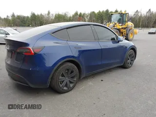 2021 Tesla Model Y Long Range with VIN 5YJYGDEE9MF071120, listed as a IAAI auction lot 40870088 with 73,438 mi miles and . Bid and sale history available at carsss.com. Image 4.