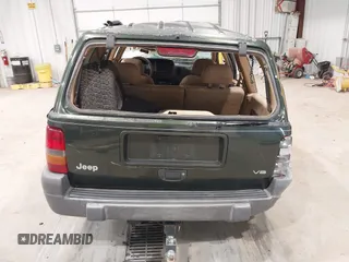 1997 Jeep Grand Cherokee Laredo z VIN 1J4GZ58YXVC729117, wystawiony jako IAAI lot #42244799 z przebiegiem Nie podano mil oraz . Historia ofert i sprzedaży dostępna na DreamBid. Obrazek 17.