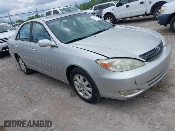 2003 Toyota Camry LE with VIN 4T1BE30K13U168509, listed as a IAAI auction lot 42220735 with 210,328 mi miles and . Bid and sale history available at DreamBid. Image 1.