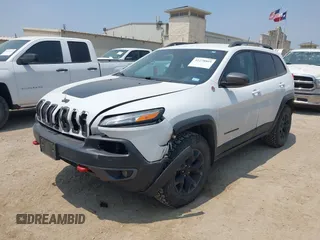 2015 Jeep Cherokee Trailhawk z VIN 1C4PJMBS5FW574102, wystawiony jako IAAI lot #42278805 z przebiegiem 164 250 mil mil oraz . Historia ofert i sprzedaży dostępna na DreamBid. Obrazek 2.