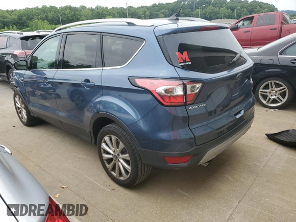 2018 Ford Escape Titanium with VIN 1FMCU9J93JUC01903, listed as a Copart auction lot 57337045 with 59,276 mi miles and Salvage title. Bid and sale history available at DreamBid. Image 2.