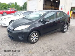 2013 Ford Fiesta SE z VIN 3FADP4BJ6DM218088, wystawiony jako IAAI lot #42319209 z przebiegiem 109 208 mil mil oraz . Historia ofert i sprzedaży dostępna na DreamBid. Obrazek 2.