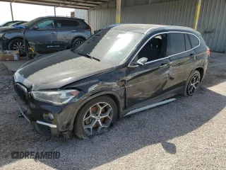 2018 BMW X1 sDrive28i with VIN WBXHU7C33J5H42084, listed as a Copart auction lot 48239035 with 65,717 mi miles and Clean Title. Bid and sale history available at carsss.com. Image 1.