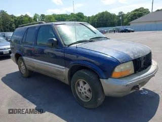 2001 GMC Jimmy SLE z VIN 1GKDT13W612136433, wystawiony jako IAAI lot #42336277 z przebiegiem Nie podano mil oraz . Historia ofert i sprzedaży dostępna na DreamBid. Obrazek 1.