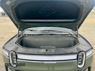 2023 Rivian R1S Launch Edition with VIN 7PDSGABL2PN003733, listed as a Copart auction lot 56033315 with 9,996 mi miles and Salvage Title. Bid and sale history available at carsss.com. Image 7.