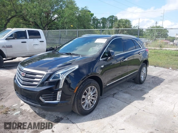 2017 Cadillac XT5 FWD with VIN 1GYKNARS6HZ123114, listed as a IAAI auction lot 41933928 with 166,213 mi miles. Bid and sale history available at carsss.com. Image 2.