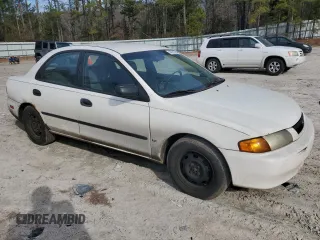 1998 Mazda Protege DX z VIN JM1BC1416W0194406, wystawiony jako Copart lot #44535955 z przebiegiem 312 942 mil mil oraz Szkoda całkowita • Salvage title. Historia ofert i sprzedaży dostępna na DreamBid. Obrazek 4.