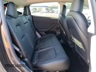 2024 Tesla Model Y with VIN 7SAYGDED3RF151031, listed as a Copart auction lot 49494165 with 7,503 mi miles and Salvage Title. Bid and sale history available at DreamBid. Image 11.