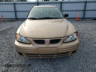1999 Pontiac Grand Am SE2 with VIN 1G2NE52EXXM716313, listed as a Copart auction lot 86522744 with 102,438 mi miles and Salvage Title. Bid and sale history available at carsss.com. Image 5.