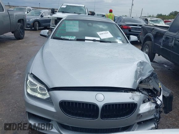 2015 BMW 6 Series 640i z VIN WBA6A0C51FD318982, wystawiony jako IAAI lot #41875547 z przebiegiem 60 968 mil mil oraz . Historia ofert i sprzedaży dostępna na DreamBid. Obrazek 12.