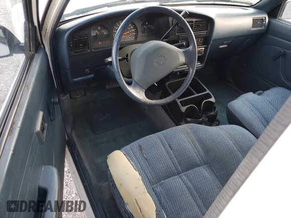 1993 Toyota Pickup DLX z VIN JT4RN93P7P5074129, wystawiony jako Copart lot #72893054 z przebiegiem 235 053 mil mil oraz Szkoda całkowita • Salvage title. Historia ofert i sprzedaży dostępna na DreamBid. Obrazek 8.