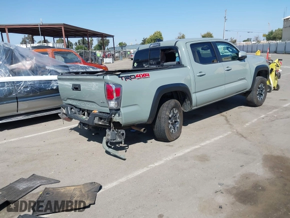 2022 Toyota Tacoma SR with VIN 3TMCZ5AN0NM489420, listed as a IAAI auction lot 42597175 with 129,340 mi miles and . Bid and sale history available at DreamBid. Image 4.