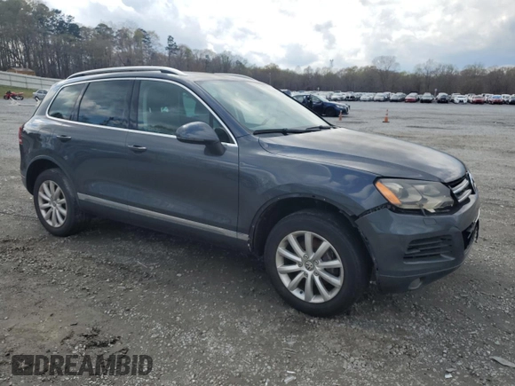 2012 Volkswagen Touareg Sport с VIN WVGEK9BP7CD006059, выставлен на аукционе Copart как лот 49411245 с пробегом 202 323 миль миль и Чистый • Clean title. История ставок и продаж доступна на DreamBid. Изображение 4.