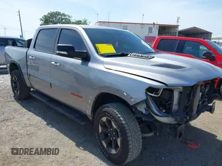 2022 Ram 1500 Rebel z VIN 1C6SRFLT2NN351050, wystawiony jako IAAI lot #41976882 z przebiegiem 59 490 mil mil oraz . Historia ofert i sprzedaży dostępna na DreamBid. Obrazek 1.