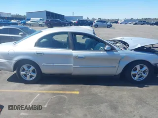 2003 Mercury Sable GS z VIN 1MEFM50U83A608330, wystawiony jako IAAI lot #41652880 z przebiegiem 218 651 mil mil oraz . Historia ofert i sprzedaży dostępna na DreamBid. Obrazek 13.