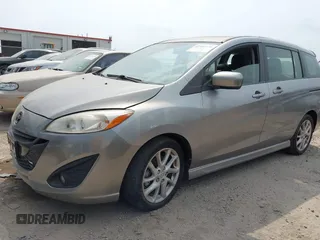 2012 Mazda 5 Grand Touring z VIN JM1CW2DL1C0126545, wystawiony jako IAAI lot #42301130 z przebiegiem 151 212 mil mil oraz . Historia ofert i sprzedaży dostępna na DreamBid. Obrazek 2.