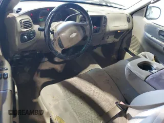 2003 Ford F-150 XL with VIN 1FTRX17283NA46215, listed as a Copart auction lot 85194094 with 168,415 mi miles and Salvage title. Bid and sale history available at DreamBid. Image 8.