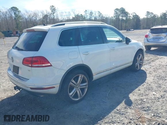 2016 Volkswagen Touareg Sport with VIN WVGEF9BP5GD012680, listed as a IAAI auction lot 41610943 with 153,952 mi miles and . Bid and sale history available at DreamBid. Image 4.