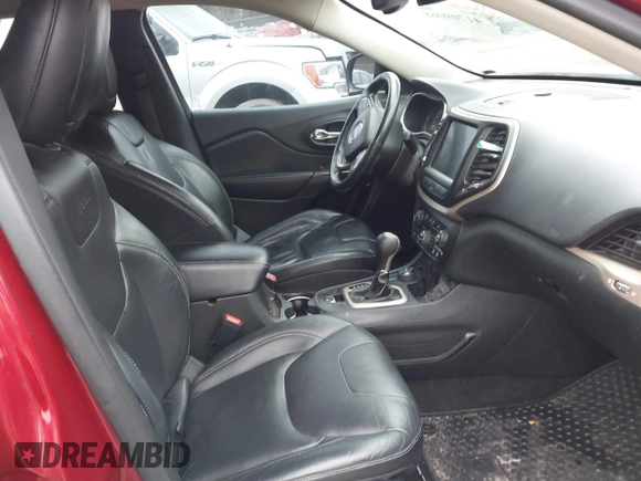 2015 Jeep Cherokee Latitude with VIN 1C4PJMCS6FW594812, listed as a IAAI auction lot 41709068 with 125,232 mi miles. Bid and sale history available at carsss.com. Image 5.