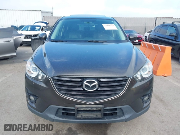 2016 Mazda CX-5 Grand Touring z VIN JM3KE4DY2G0684066, wystawiony jako IAAI lot #42078725 z przebiegiem 200 129 mil mil oraz . Historia ofert i sprzedaży dostępna na DreamBid. Obrazek 12.