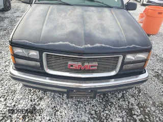1999 GMC Yukon with VIN 1GKEC13R7XJ802387, listed as a Copart auction lot 82819934 with 438,574 mi miles and Salvage Title. Bid and sale history available at carsss.com. Image 12.