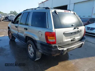 2000 Jeep Grand Cherokee Laredo z VIN 1J4GW48S8YC244168, wystawiony jako IAAI lot #41907447 z przebiegiem 243 154 mil mil oraz . Historia ofert i sprzedaży dostępna na DreamBid. Obrazek 3.