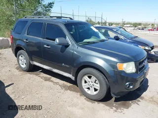 2009 Ford Escape Hybrid with VIN 1FMCU59349KB02605, listed as a IAAI auction lot 42552044 with 127,442 mi miles and . Bid and sale history available at DreamBid. Image 1.